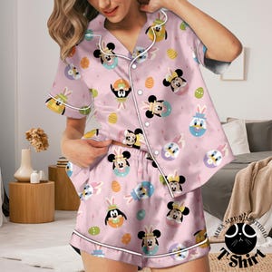 May include: A set of three ceramic mugs with a speckled, matte finish. Each mug features a different color: light blue, cream, and gray. The mugs have a simple, modern design and a comfortable handle.