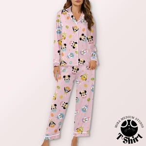 May include: A white ceramic mug with a black handle and the text "But First, Coffee" in a black, bold font. The mug is on a white surface. The mug is approximately 4 inches tall.