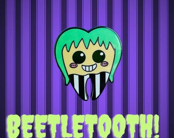 Dental themed  Beetlejuice tooth shaped enamel pin.
