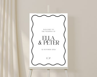 May include: A white wedding welcome sign with a black wavy border. The sign reads "Welcome to the wedding of Ella & Peter 12 October 2024 E|P".