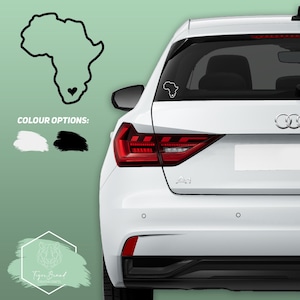 May include: A white car with a black outline of the continent of Africa with a heart in the middle on the back window. The car has a black bumper and black taillights. The text "COLOUR OPTIONS:" is displayed above two swatches of color, one white and one black.
