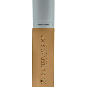 May include: A brown glass bottle with a silver cap. The bottle is labeled "Oil Perfume Shop" and "Simply Magical".