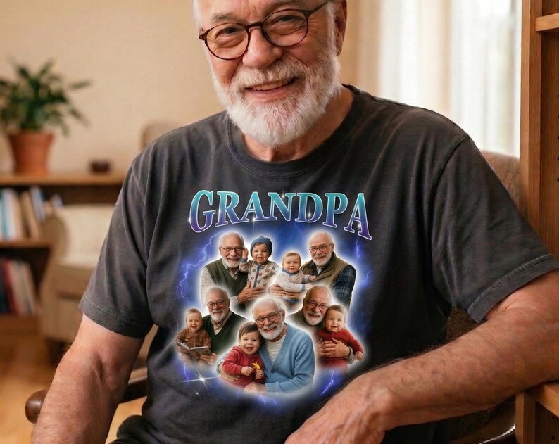 May include: A dark gray t-shirt with the word "GRANDPA" in a blue and purple font. The shirt features a graphic of a grandfather with several children. The man in the image is wearing glasses and smiling.