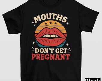 May include: Black t-shirt with a retro design featuring a pair of red lips inside a sunset circle. The text "MOUTHS DON'T GET PREGNANT" is printed above and below the lips in a vintage font.