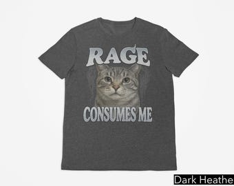 Puede incluir: Camiseta gris oscuro jaspeada con un gráfico de un gato y el texto "RAGE CONSUMES ME".