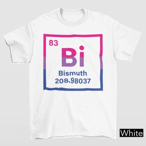 May include: White t-shirt with a graphic design featuring the word "Bi" in pink and purple, inside a square with pink, purple, and blue stripes. The number "83" is above the word, and "Bismuth 208.98037" is below.