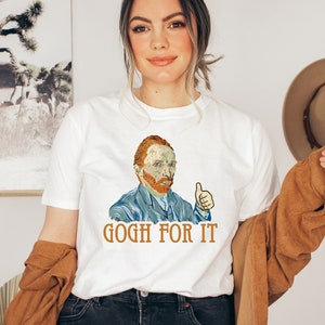 May include: White t-shirt with a colorful illustration of Vincent van Gogh giving a thumbs up. The text "GOGH FOR IT" is printed below the illustration.