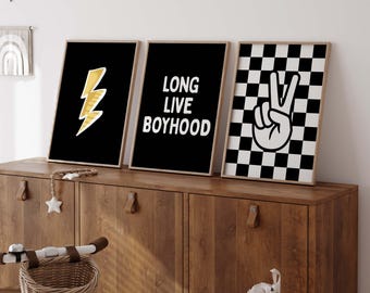 May include: Three black and white framed prints with a checkered pattern, a lightning bolt, and the text "Long Live Boyhood".