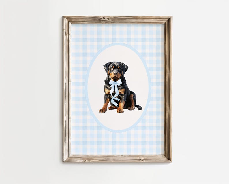 May include: A framed print featuring a Rottweiler dog with a blue bow tie, set against a light blue and white gingham pattern. The dog is centered within a light blue oval, adding a touch of elegance to the artwork. The frame is a natural wood color.