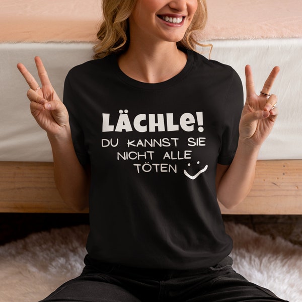 Lächle du kannst sie nicht alle töten | Lustiges Sprüche Shirt für den Alltag