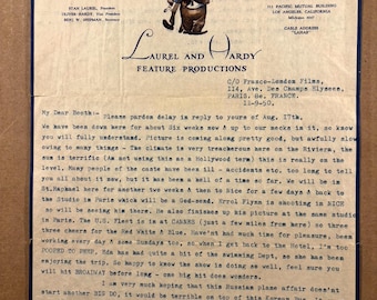 May include: A vintage letter on aged paper, featuring the Laurel and Hardy Feature Productions logo and a cartoon illustration of the comedy duo. The letter is handwritten and includes the words "Air Mail."