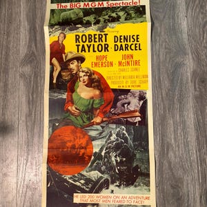 May include: Vintage movie poster for "Westward the Women." The poster features a cowboy and woman in the center, with a red and yellow background. The text includes the film's title, cast, and tagline: "He led 200 women on an adventure that most men feared to face!"