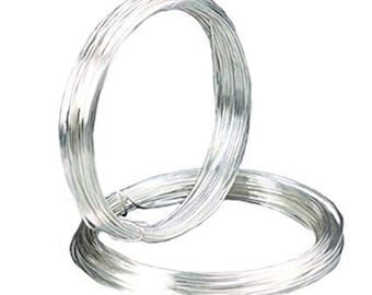May include: Two coils of shiny, silver-colored wire are displayed against a white background. The wire is tightly wound into circular shapes, with one coil resting partially on top of the other. The wire appears to be made of a smooth, metallic material.