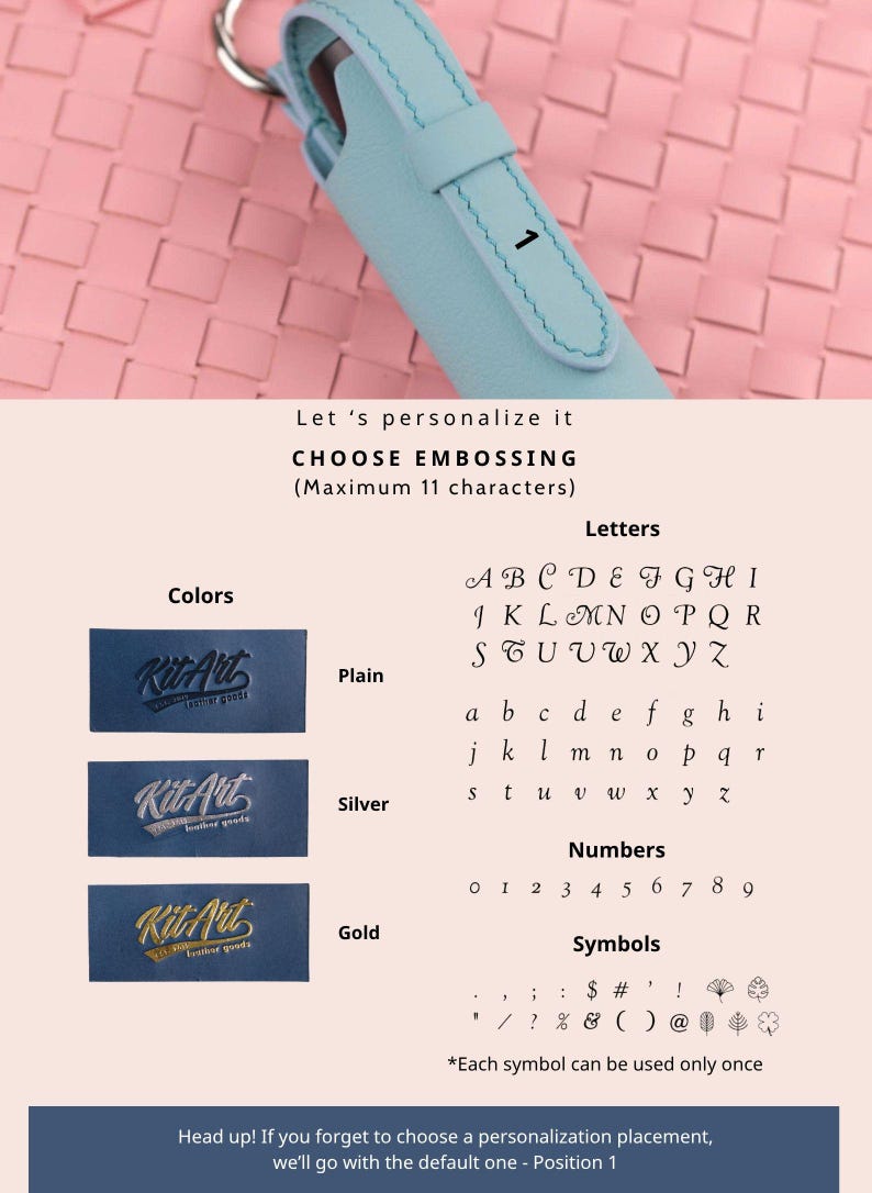 May include: A light blue leather keychain case with a metal ring and the number 1 embossed on the front. The image includes a personalization guide showing options for plain, silver, or gold embossing, along with letters, numbers, and symbols.