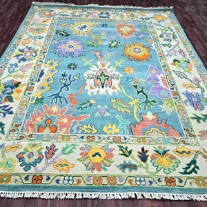 Handmade Blue Floral Wool Rug: Oushak Style, New Zealand Wool