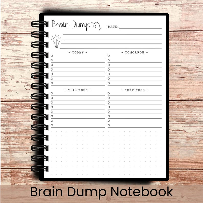 May include: A black spiral-bound notebook with the words "Brain Dump" and a lightbulb graphic at the top. The notebook has sections for "Today," "Tomorrow," "This Week," and "Next Week," with lines and checkboxes for notes. The words "Brain Dump Notebook" are at the bottom.