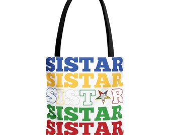 May include: A white tote bag with black handles featuring the word SISTAR repeated in five horizontal rows. The text colours are blue, yellow, white, green, and red. The third row replaces the letter A with a multi-coloured five-pointed star emblem.