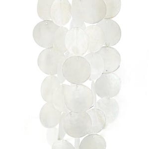 May include: A white capiz shell wind chime with a natural wood top. The chime features multiple strands of round, flat shells, creating a cascading effect. The shells are translucent and have a pearlescent sheen.