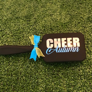Elevate your cheer team's style with our custom cheer team brushes! Personalized to perfection, these brushes are essential accessories for every cheerleader.