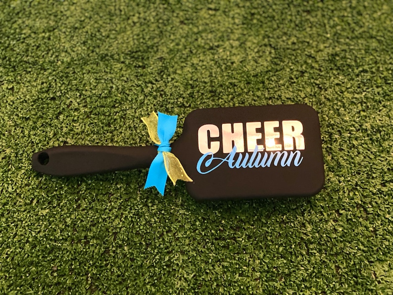 Elevate your cheer team's style with our custom cheer team brushes! Personalized to perfection, these brushes are essential accessories for every cheerleader.