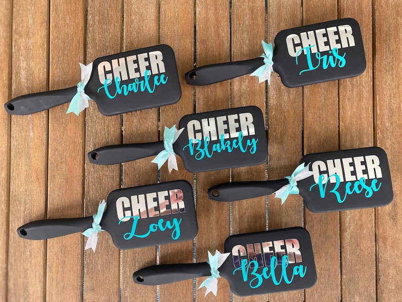 Elevate your cheer team's spirit with our personalized cheer team brushes! Customized to perfection, these brushes are essential accessories for every cheerleader.