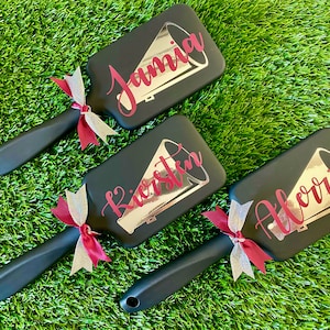 Perfect for competitions, practices, or everyday grooming, our custom cheer team brushes are the ultimate expression of team pride.