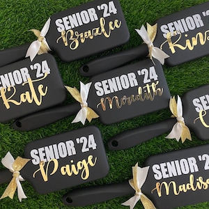 Express your team's spirit with our custom cheer team brushes! Personalized to perfection, these brushes are essential accessories for every cheerleader.