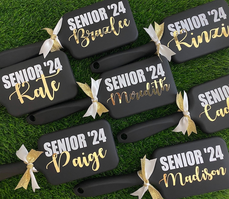 Express your team's spirit with our custom cheer team brushes! Personalized to perfection, these brushes are essential accessories for every cheerleader.