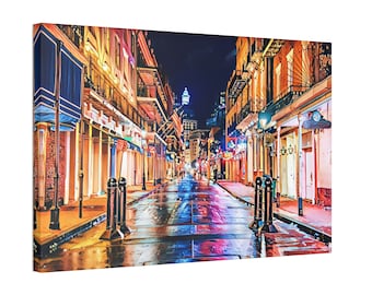 May include: A painting of a street scene in New Orleans at night. The street is wet from rain and the buildings are lit up with colorful lights. There are people walking on the street and a tall building in the distance.