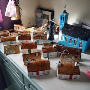 Driftwood made traditional Irish cottages and plaques. Handmade models can be replicated from photos.