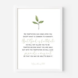 May include: White framed print with a minimalist design. The print features a sprig of green leaves at the top and inspirational text in a mix of fonts. The text includes the phrase "But God is faithful" and a Bible verse reference.