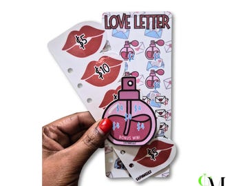 May include: A Love Letter themed savings challenge tracker featuring red lip icons with $5 and $10 labels, pink perfume bottle icons with dollar amounts, and a Bonus Mini perfume bottle sticker. The white card has punched holes for binder storage.