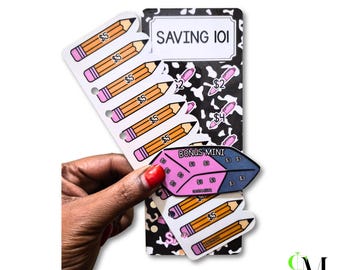 May include: A set of paper money saving trackers featuring a black and white cow print background with the text SAVING 101. The trackers include illustrations of yellow pencils labeled with $5 and a purple leaf-shaped BONUS MINI tracker with $3.