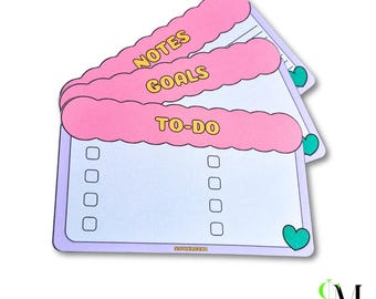 May include: A stack of three rectangular paper note pads with light purple borders and scalloped pink headers. The top pad features the text TO-DO with two columns of checkboxes. The pads below are labeled NOTES and GOALS. Each pad has a small green heart.