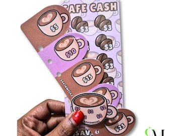 May include: A set of layered paper savings trackers titled SAFE CASH, featuring coffee cup illustrations with dollar amounts like $5, $10, $15, and $25. The cards have brown and purple tones, coffee bean graphics, and the brand name SAVIN MEEKZ printed on them.