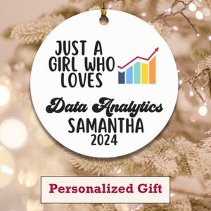 May include: A white round ornament with the text "JUST A GIRL WHO LOVES Data Analytics SAMANTHA 2024" and a colorful chart graphic. The ornament has a gold string for hanging and the words "Personalized Gift" at the bottom.