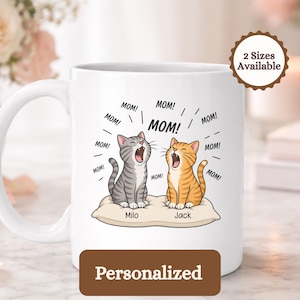 Two cartoon cats, Milo and Jack, on a pillow, with "MOM!" text.