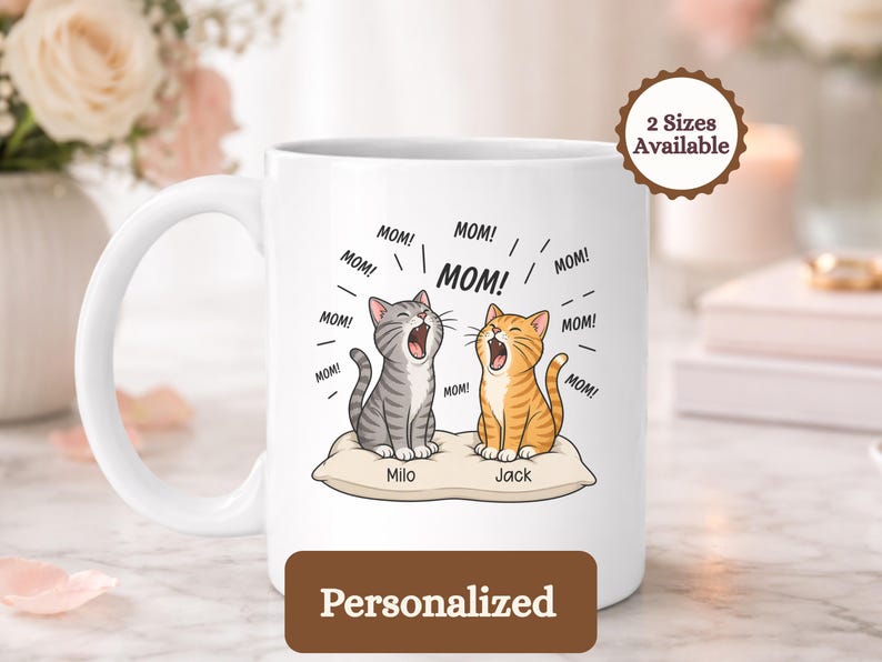 Two cartoon cats, Milo and Jack, on a pillow, with "MOM!" text.