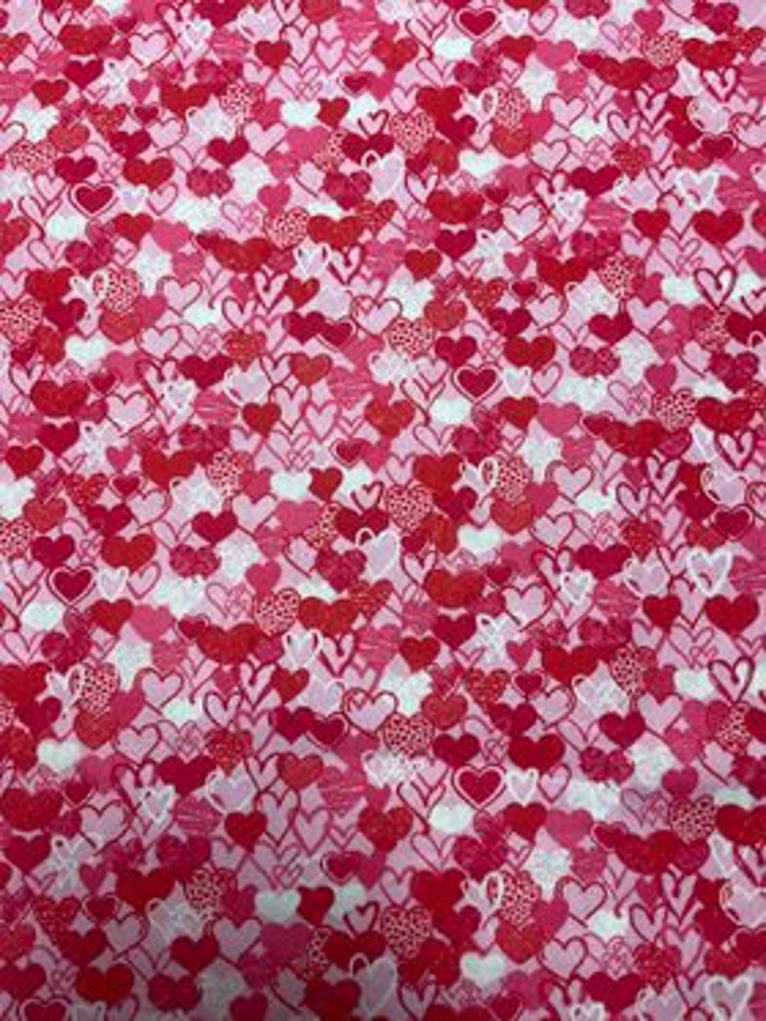 Hearts Quilting Fabric. Multiple Size Shaded Pink and Red Hearts Print