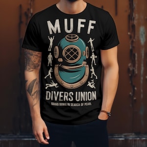 May include: Black t-shirt with a diving helmet graphic and the text "MUFF DIVERS UNION GOING DOWN IN SEARCH OF PEARL".