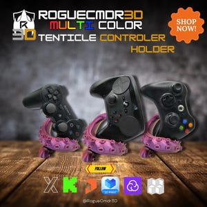 May include: A multi-color 3D tentacle controller holder with three black game controllers. The holders are purple and the text "ROGUECMDR3D" and "3D TENTICLE CONTROLLER HOLDER" are visible.