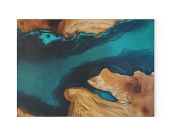 May include: A rectangular wooden art piece with a river-like design. The artwork features a combination of natural wood tones and a teal-coloured epoxy resin, creating a contrast. The design resembles a topographical map.