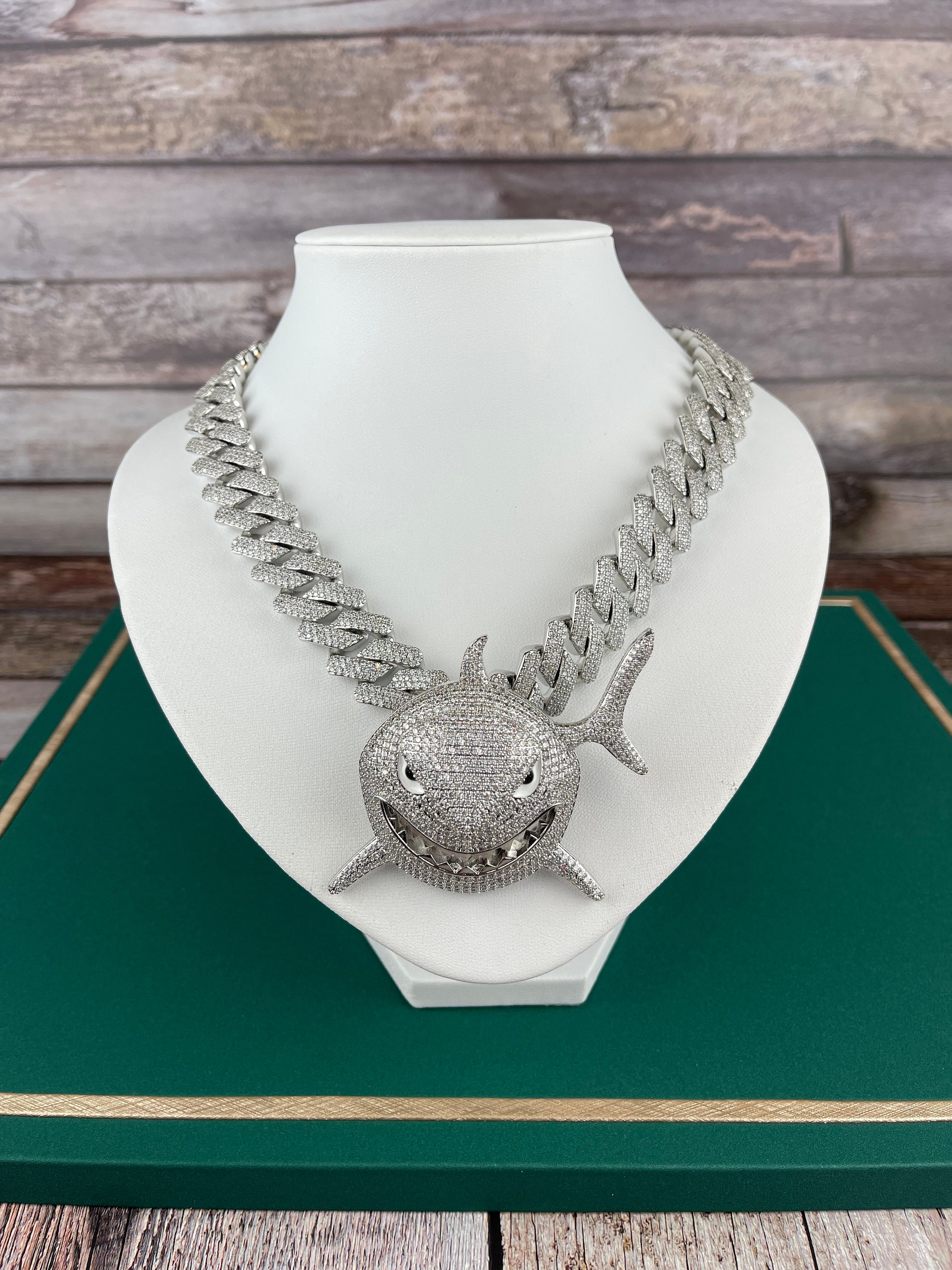 Iced out hotsell saw pendant