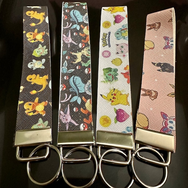 Eeveeloutions key fob lanyard keychain, faux leather, black pink, poke Mon, bulbasaur, charizard, squirtle, snorlax