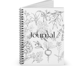 May include: A spiral-bound journal with a white cover featuring a black and white botanical illustration. The cover design includes various plants and the word "Journal" in a black, elegant font. The journal's pages are visible.