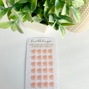 May include: A sheet of 28 pink heart-shaped stickers with the text "Happy Birthday" on each sticker. The stickers are surrounded by colorful confetti. The sheet is labeled "birthdays" and includes the quote "Every good and perfect gift is from above James 1:17".