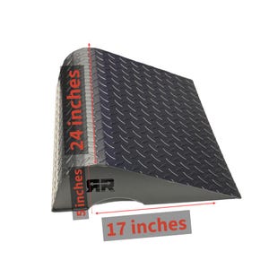 May include: A black metal ramp with a diamond plate surface. The ramp is 24 inches tall, 17 inches wide, and 5 inches deep. The ramp has the letters "RR" on the side.