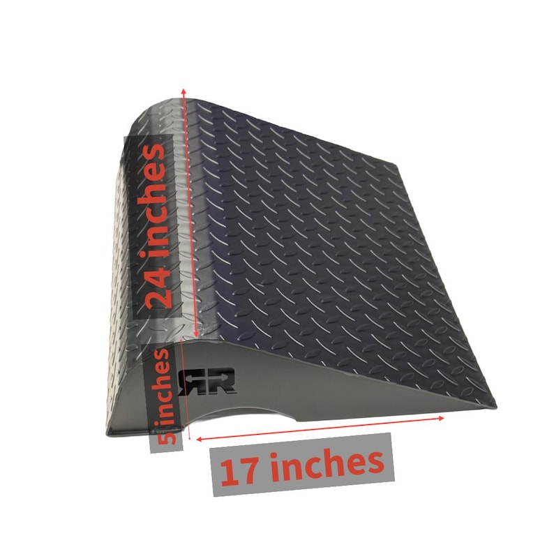 May include: A black metal ramp with a diamond plate surface. The ramp is 24 inches tall, 17 inches wide, and 5 inches deep. The ramp has the letters "RR" on the side.