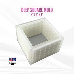 May include: A white plastic mold for making square objects. The mold is 4 inches by 4 inches by 3 inches. It has a textured surface and is made in the USA.