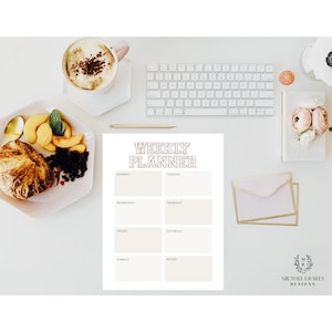 May include: A printable weekly planner with a gold and white design. The planner has spaces for each day of the week, as well as a notes section. The text "Weekly Planner" is at the top of the page.